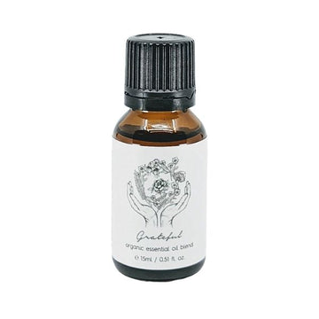 Lemon Canary Grateful Organic Essential Oil Blend bottle on white background